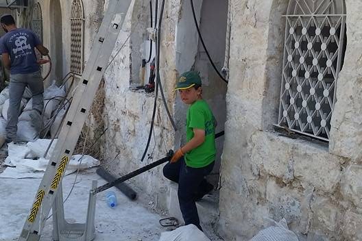 Getting things ready in Yemenite Village Getting things ready in Yemenite Village
